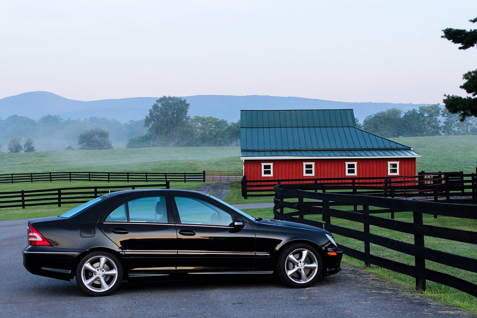 black car parked in a farm